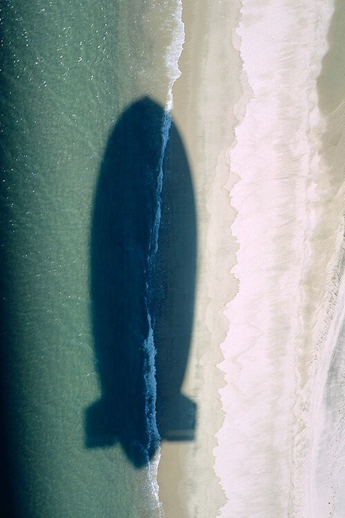 Airship shadow on a beach.