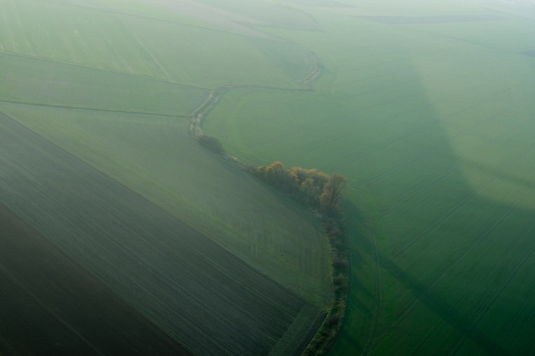 Areal view of green farmland fields
